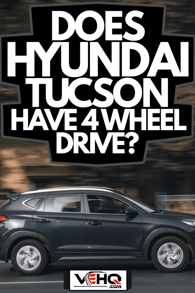 Black Hyundai Tucson car moving on the street, Black Hyundai Tucson car moving on the street, Does Hyundai Tucson Have 4 Wheel Drive?