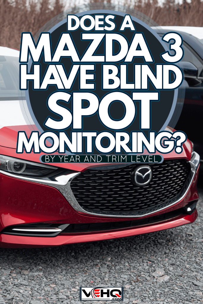 A red 2021 Mazda 3 at the dealership, Does Mazda 3 Have Blind Spot Monitoring? [By Year And Trim Level]
