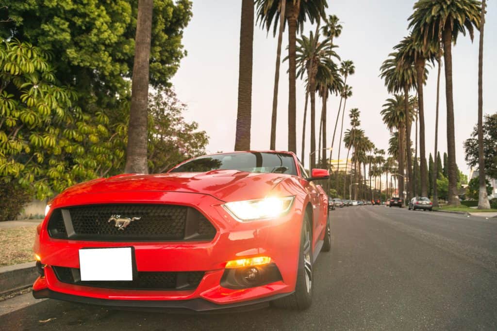 Front view of a red Ford Mustang GT car parked