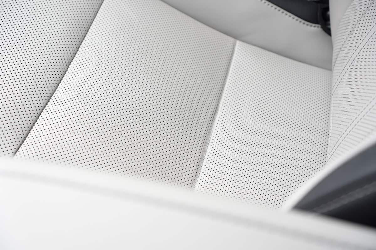 Leather ventilated seats of a modern car. Luxury car interior detail.
