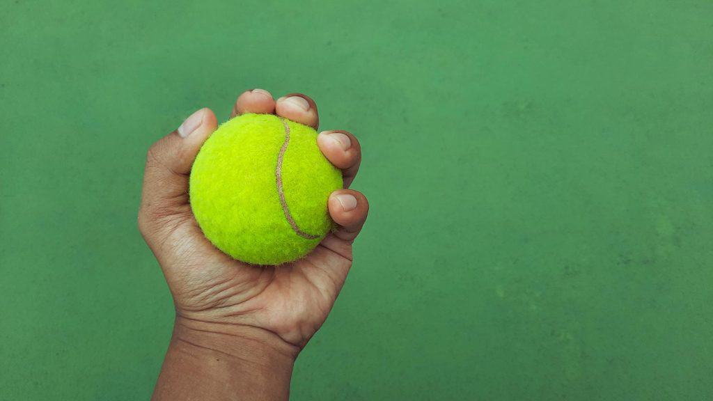 Man hand holding a tennis ball