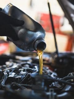 A mechanic doing car service and maintenance, What Engine Oil is Best for Hyundai Tucson?