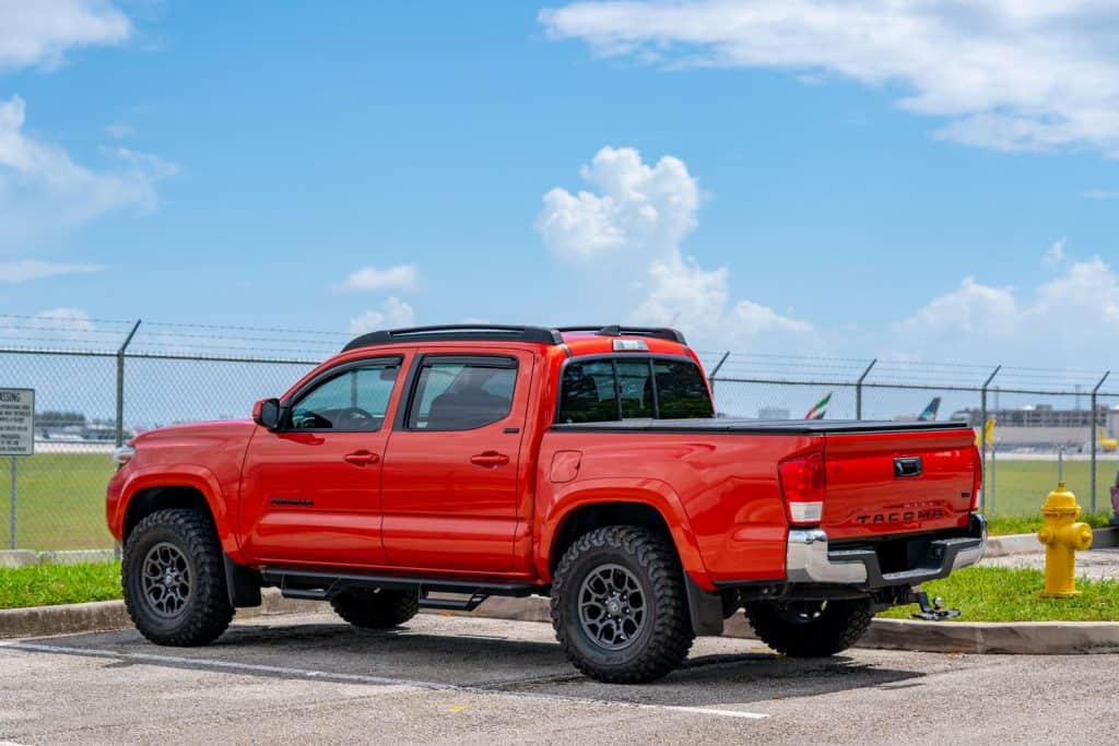 Photo of a red Toyota Tacoma in a parking lot