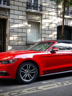 Red luxury convertible car Ford Mustang in the city street, Can A Ford Mustang Be Flat Towed?