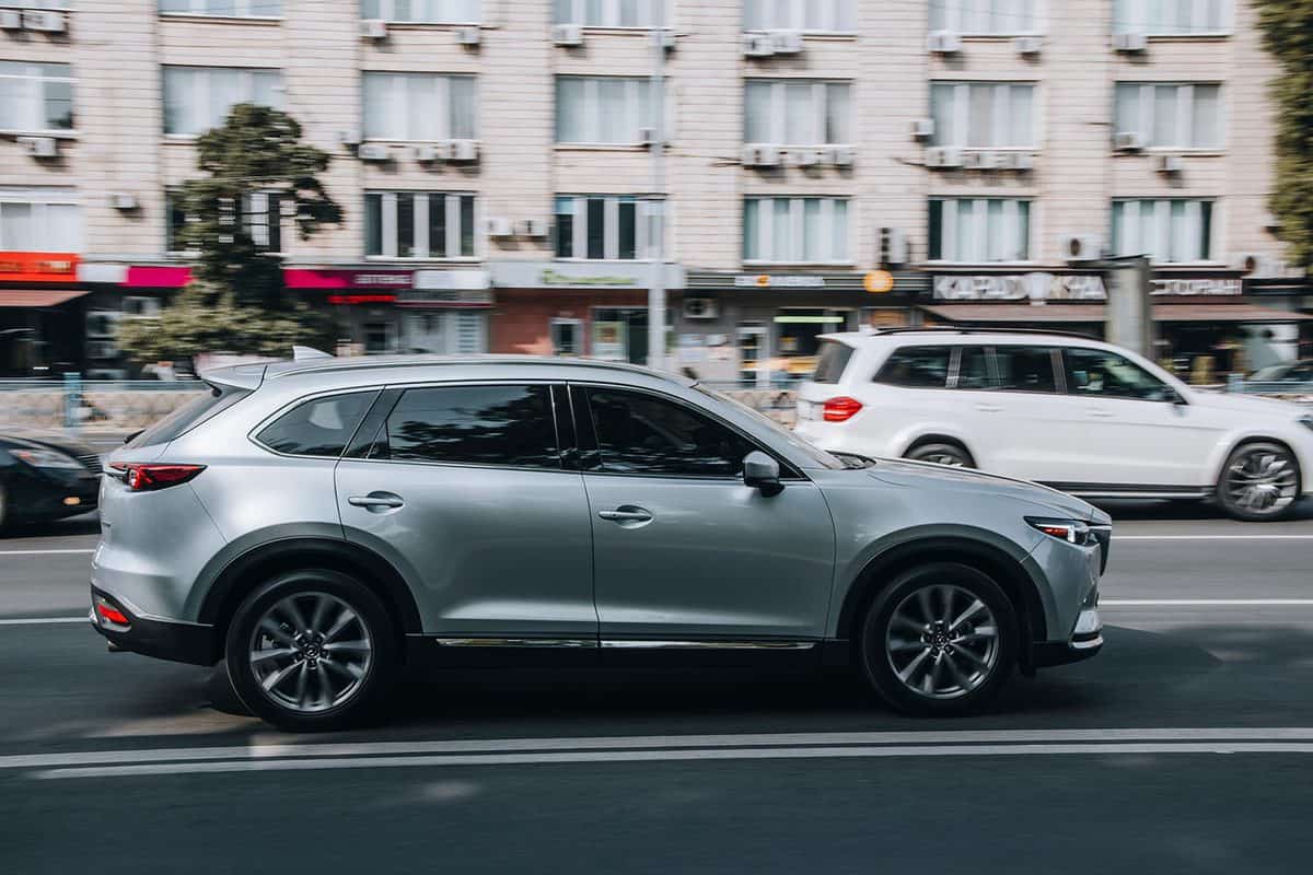Silver MAZDA CX-9 car moving on the street