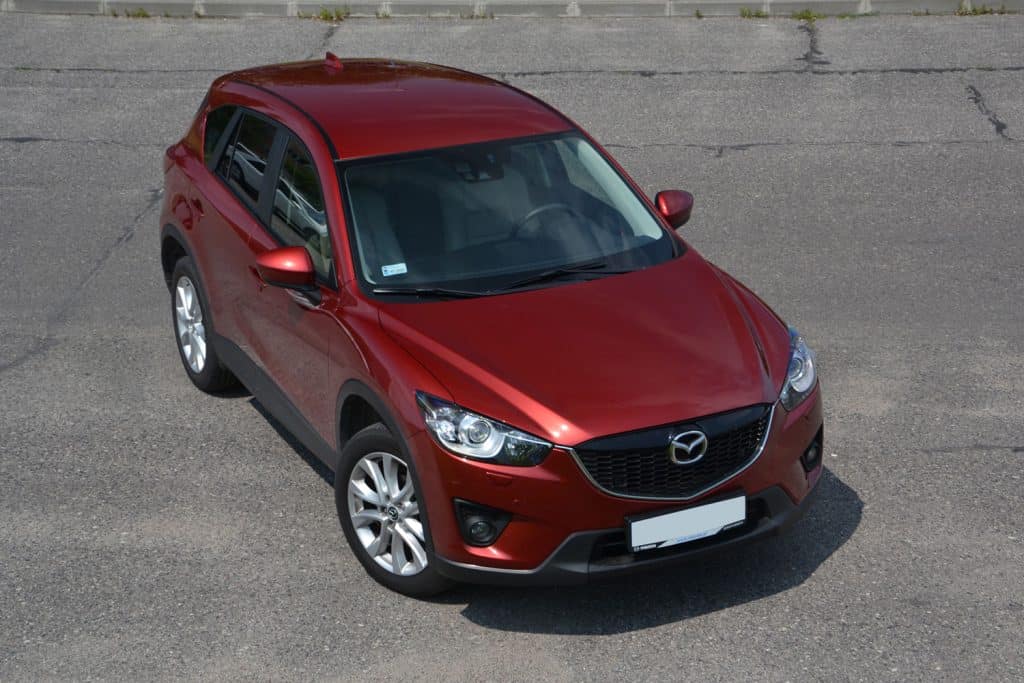 The new SUV Mazda CX-5 stopped on the road during the test drives