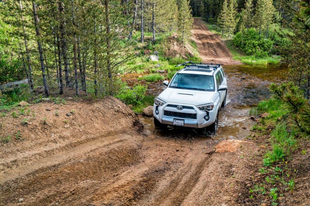 Toyota 4Runner SUV (2016 Trail edition) crossing a mountain stream 