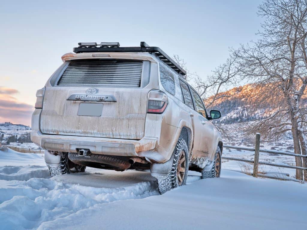 Toyota 4Runner SUV (2016 Trail edition) visiting Lory State Park at foothills of Rocky Mountains with fresh snow, winter travel and recreation in Colorado.