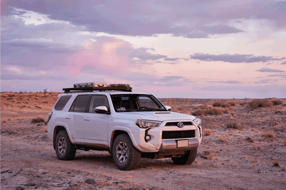 Toyota 4Runner SUV Trail model at dusk in rock desert landscape