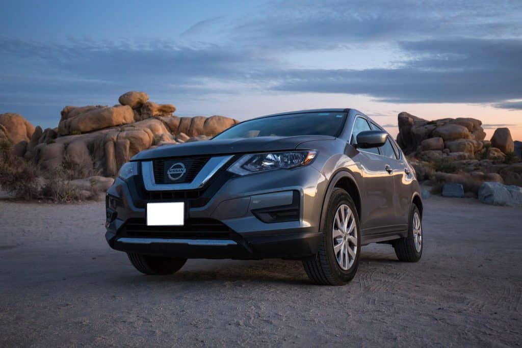 View of a grey 2017 Nissan Rogue in the desert.