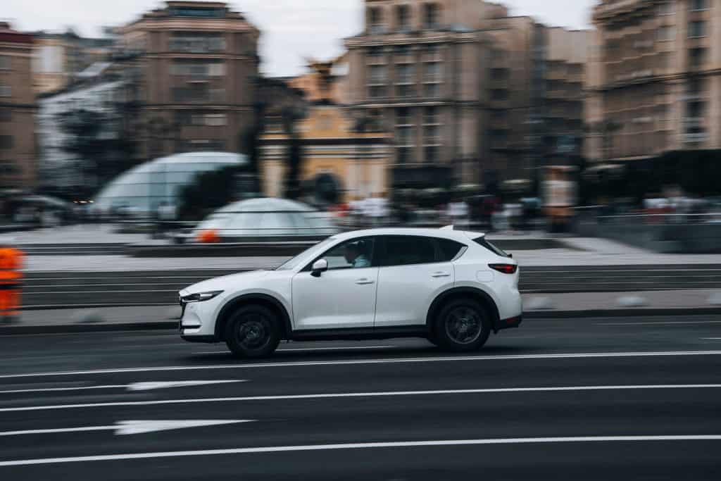 White MAZDA CX-5 car moving on the street. 