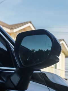 close up side view mirror of the black luxury car with blind spot monitor system, Does The Hyundai Accent Have Blind-Spot Monitoring?