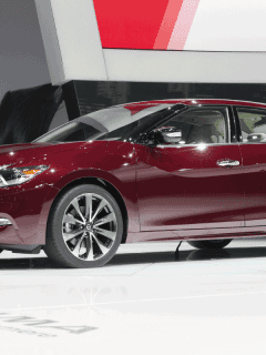 dark red nissan maxima on center stage at the international motor show. Can A Nissan Maxima Tow A Trailer