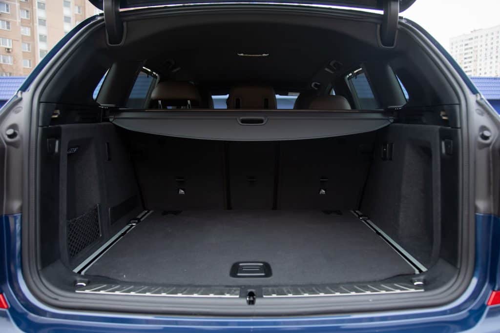 empty roomy open trunk of modern crossover car