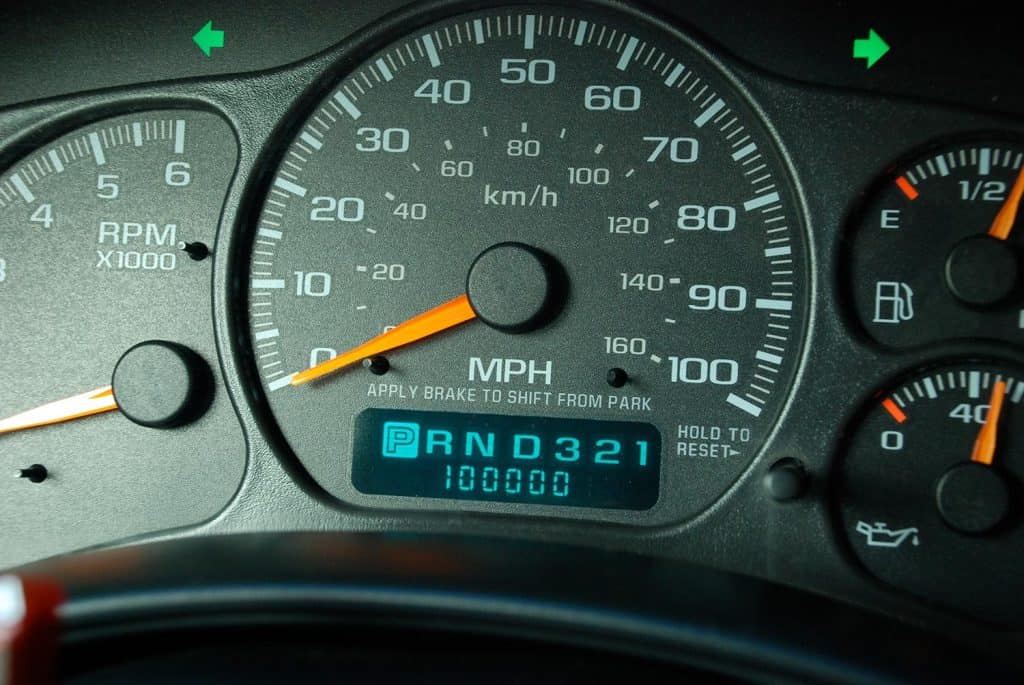 100k Miles on a dashboard of a car