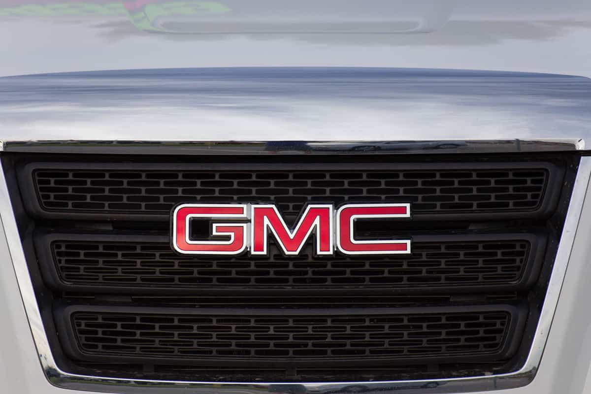 A GMC emblem in front of a GMC Acadia, GMC Acadia Won't Start - What Could Be Wrong?