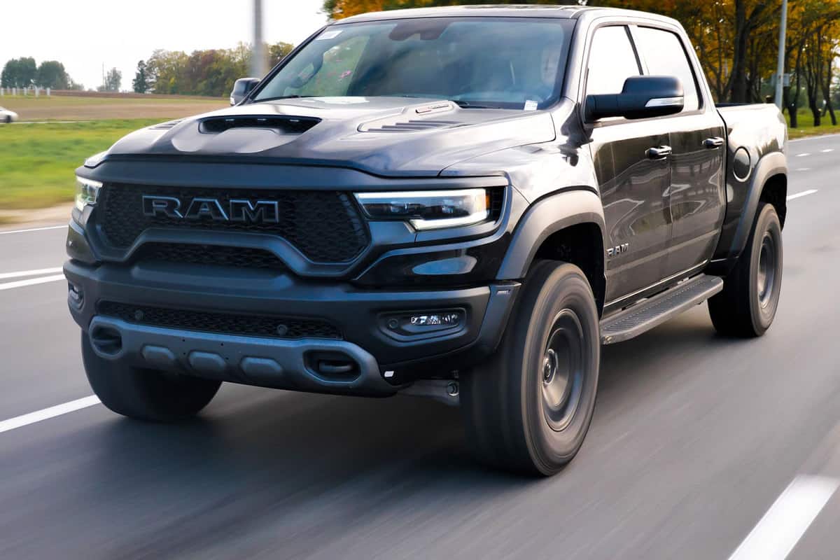 A Ram Rebel 1500 moving fast on the highway 