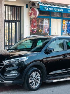 A black Hyundai Tucson patked on the side of the street, Can You Flat Tow A Hyundai Tucson?
