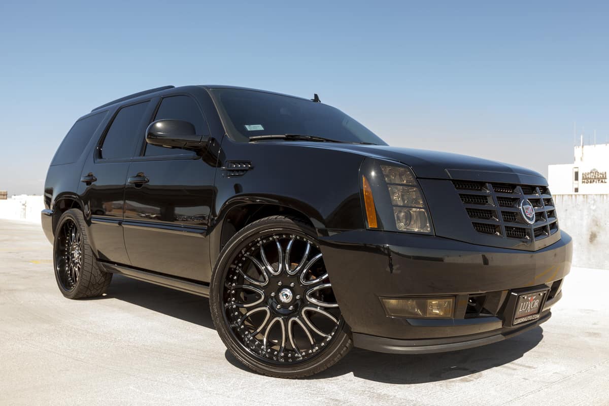 A photo of a black parked Cadillac Escalade