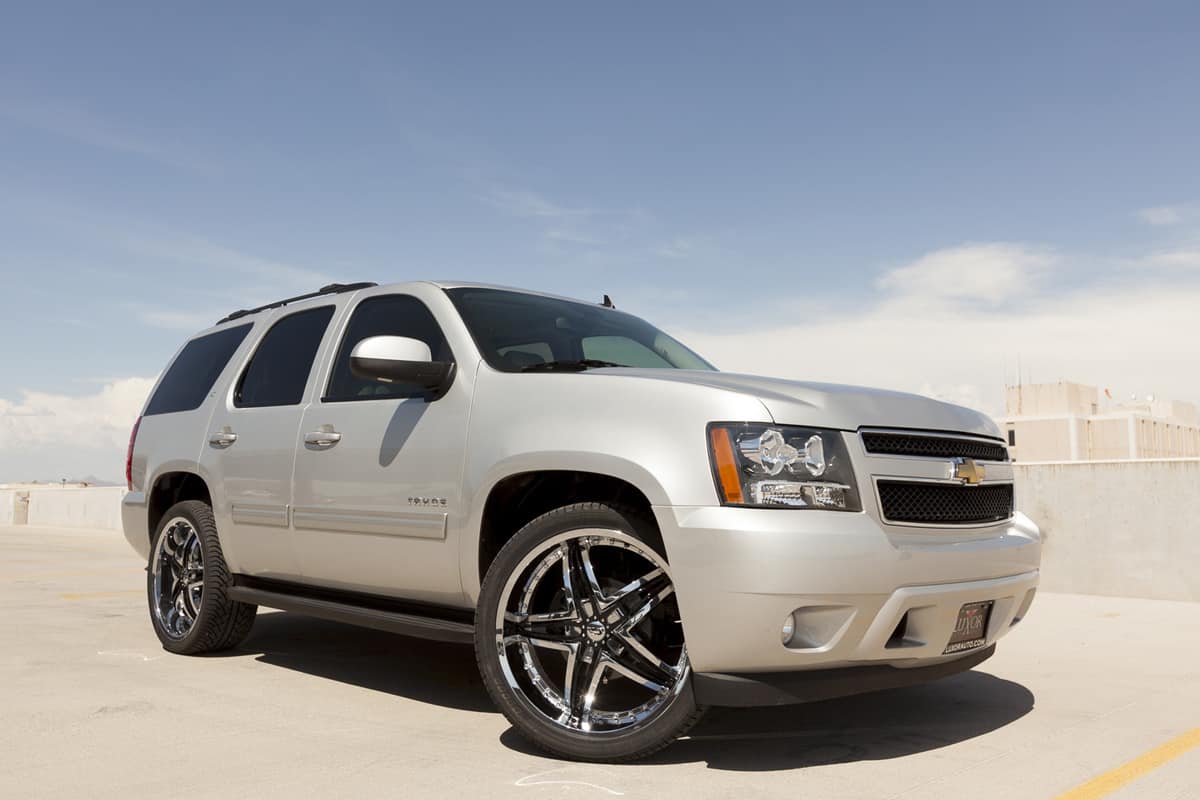 A photo of a silver Chevrolet Tahoe sport utility vehicle.