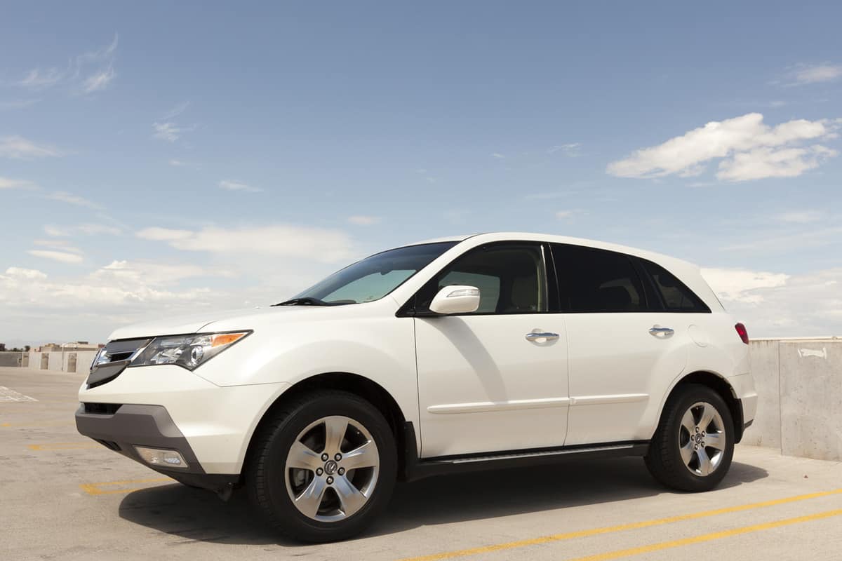  A photo of a white parked Acura MDX.