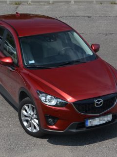 A red colored Mazda CX 5 at a parking lot, How To Turn Off The Parking Brake Mazda CX-5