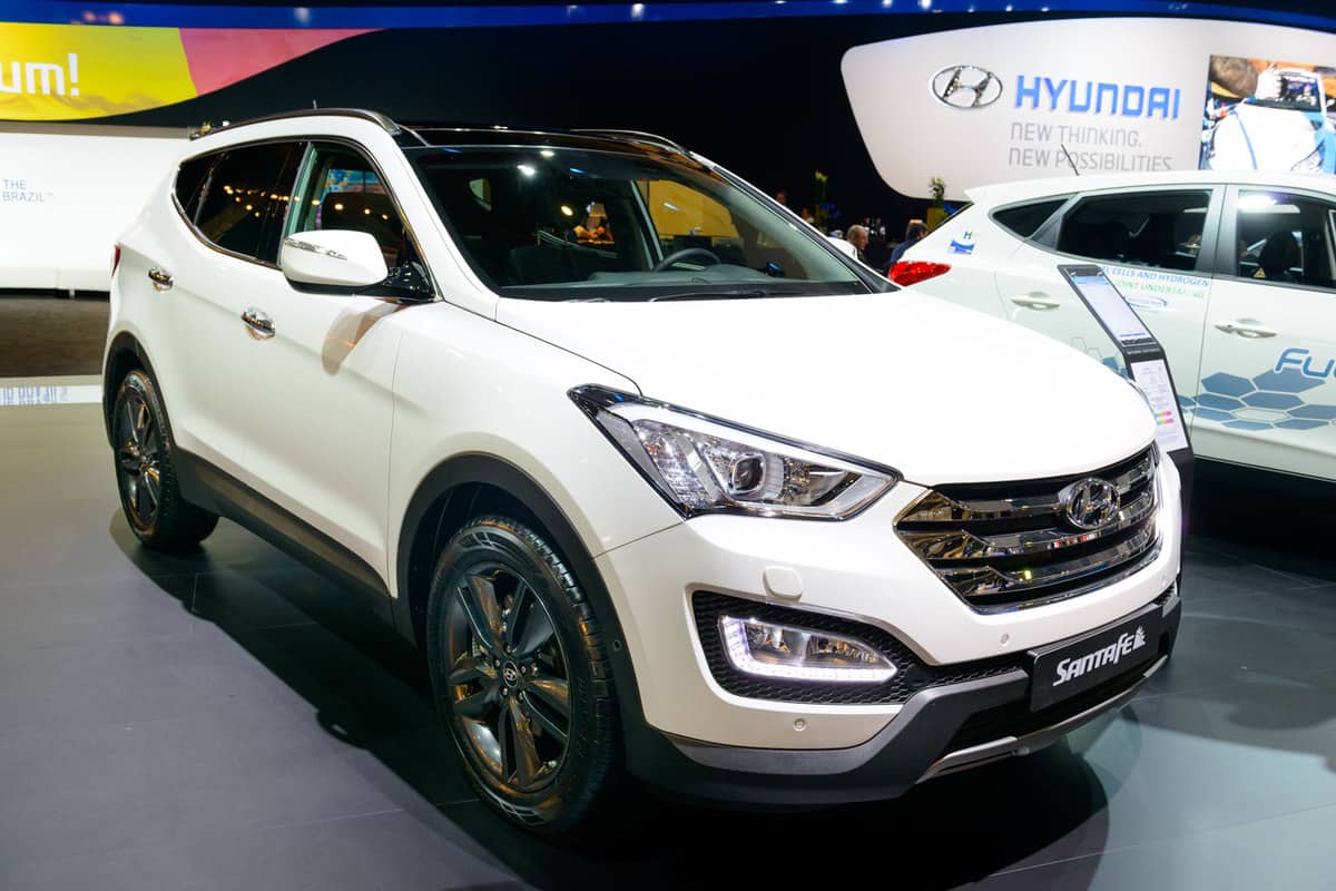 A white Hyundai Santa Fe at a car show