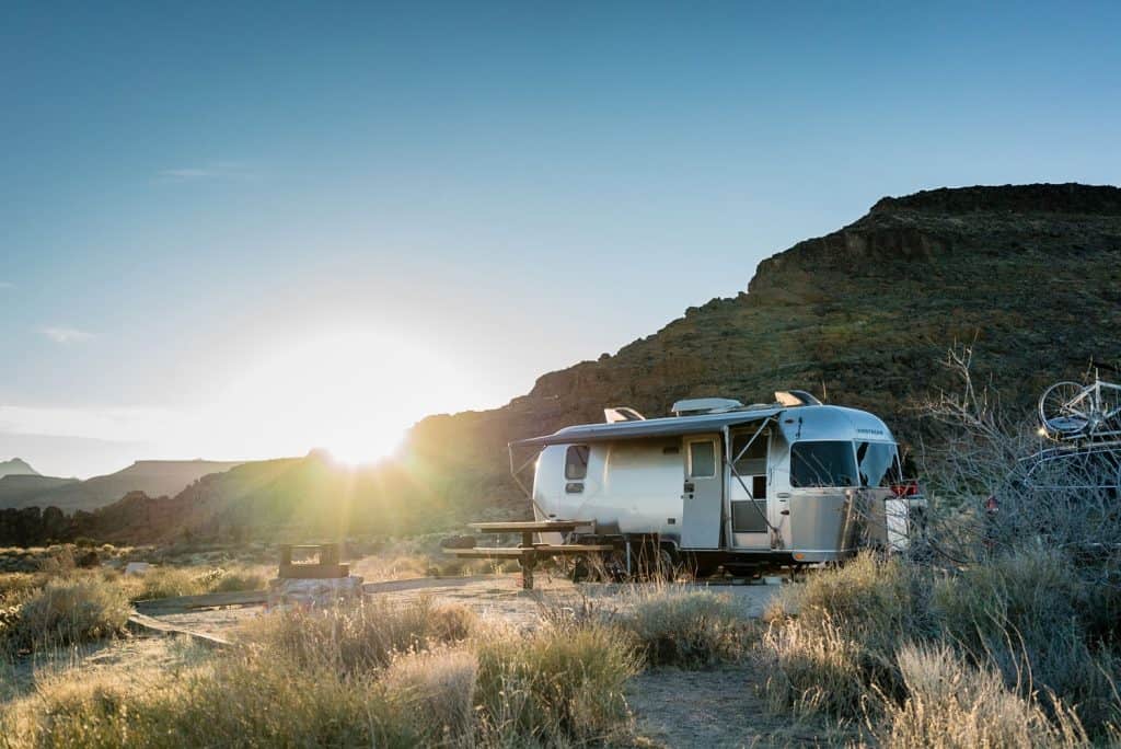 Airstream trailer parked in the Mojave Desert National Preserve at Sunset.