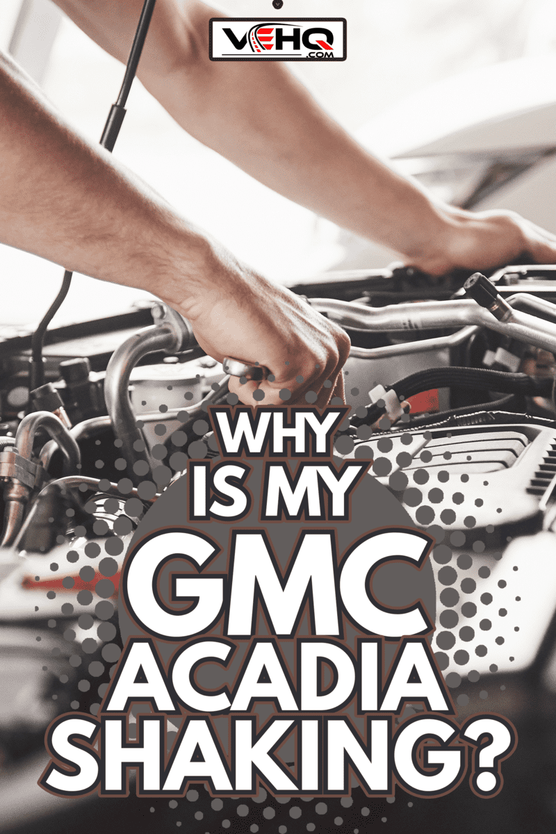 Auto mechanic working in garage. Repair service. - Why Is My GMC Acadia Shaking