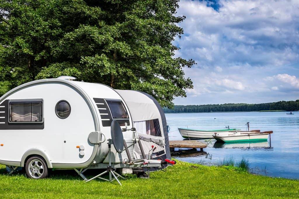Camping trailer on the lake shore