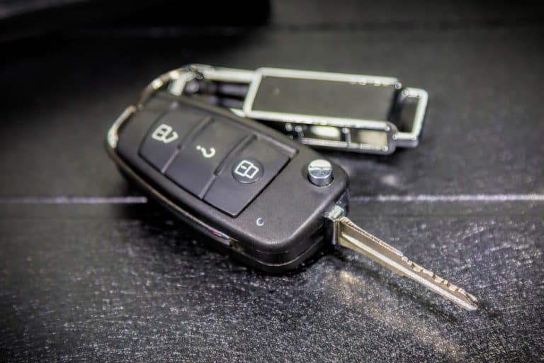 A car key fob on the leather car seat, How To Replace Battery In A Hyundai Key Fob