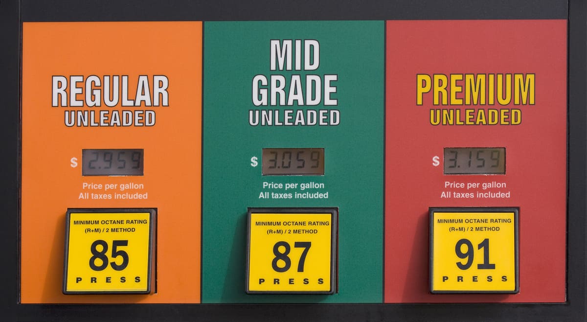 Colorado gas prices at a pump with press buttons - regular, mid grade and premium unleaded