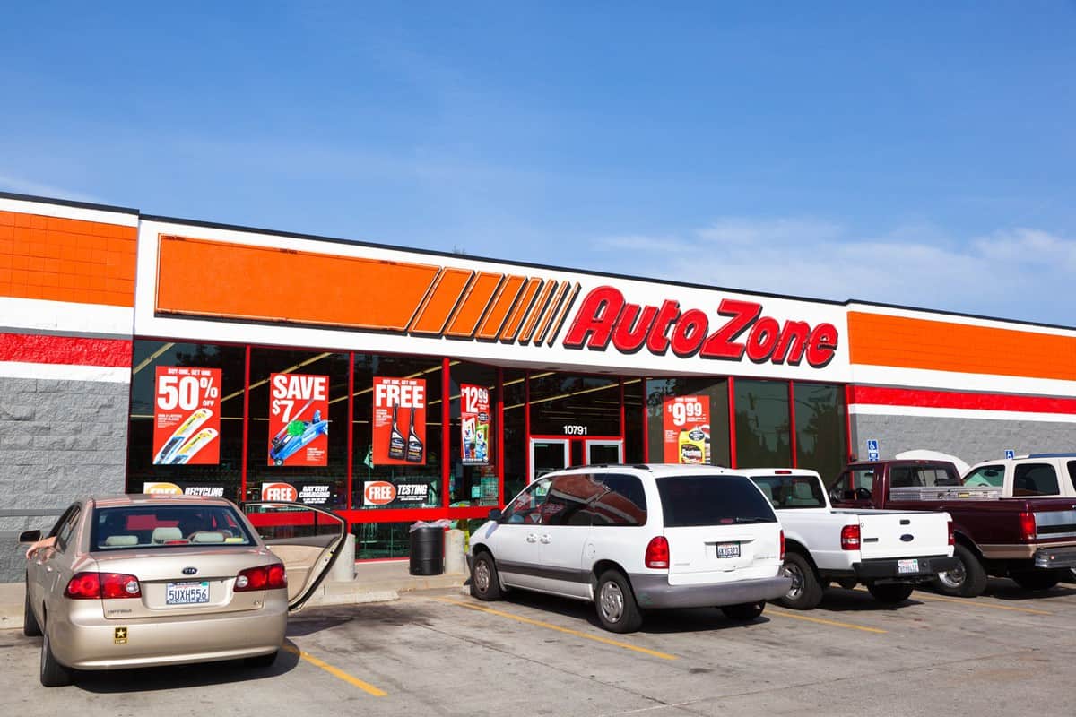 Customer cars parked in front of AutoZone auto parts store