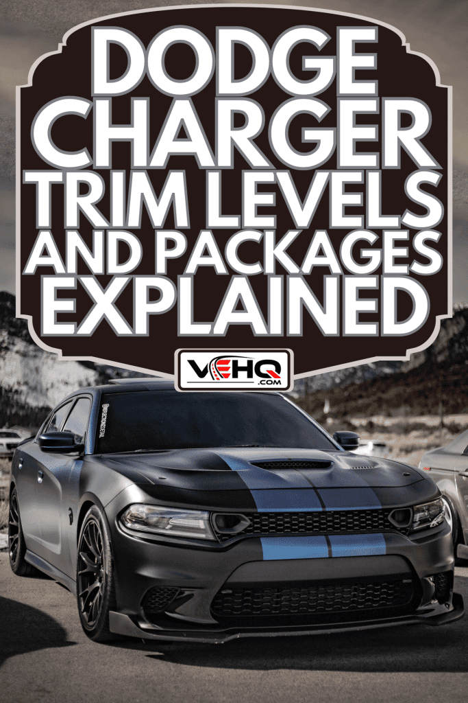 Black with blue stripes Dodge Charger Hellcat parked infront of snow mountains, Dodge Charger Trim Levels And Packages Explained