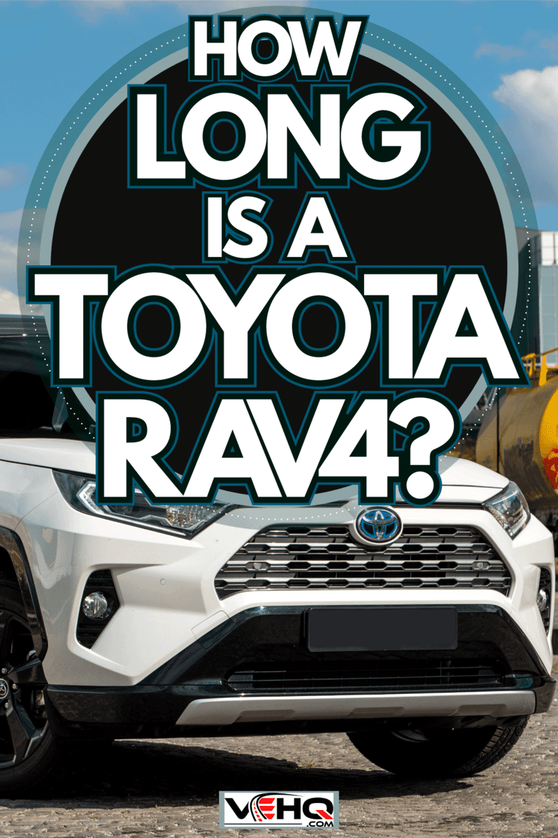 A white Toyota Rav4 photographed at a shipping dock, How Long Is A Toyota RAV4?