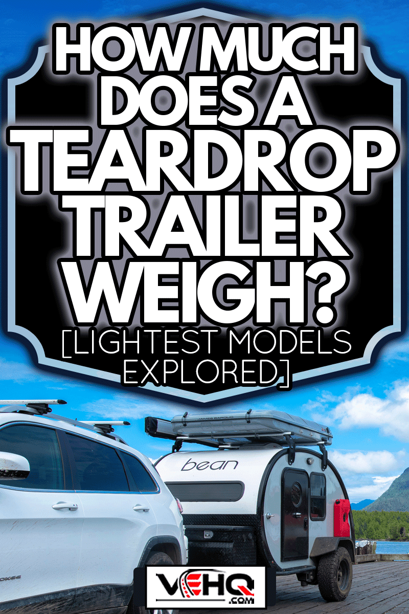 Teardrop Trailer Parked on a Dock Overlooking the Sea, How Much Does a Teardrop Trailer Weigh? [Lightest Models Explored]