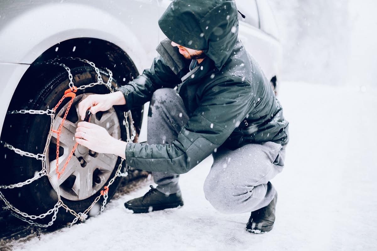 Mountaing chains on tires on heavy snow weather