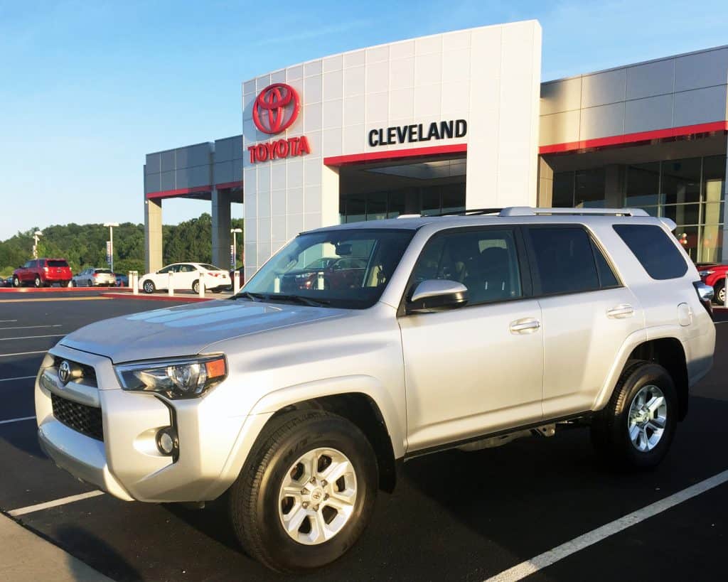 New Toyota 4Runner on display in front of a Toyota dealership.