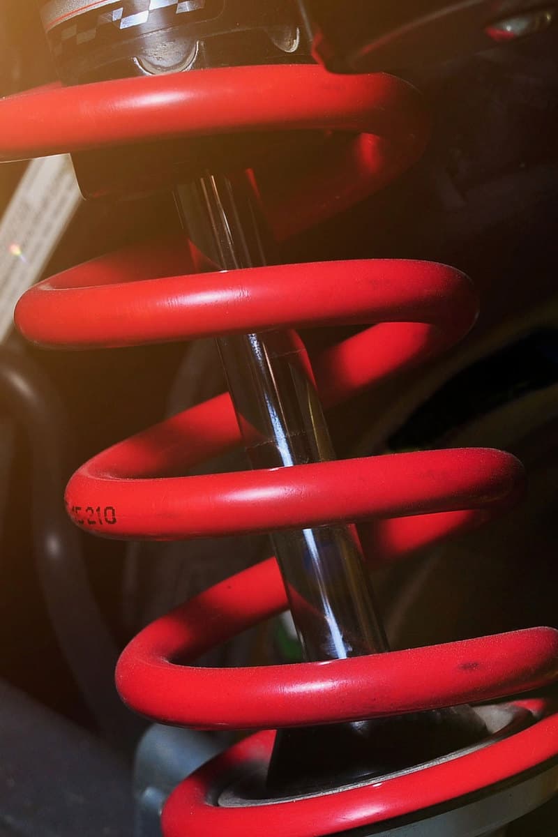 Red color shock absorber focus for suspension