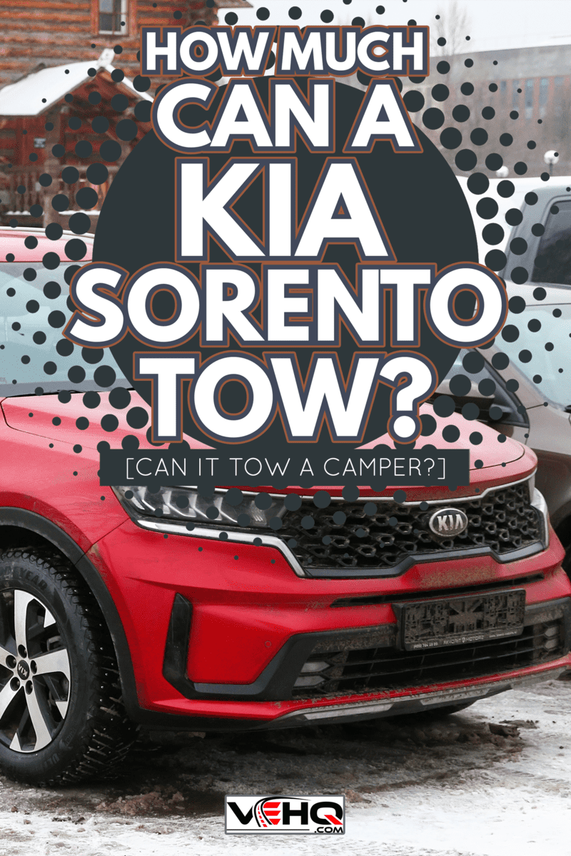 Red crossover Kia Sorento in the city street - How Much Can A Kia Sorento Tow [Can It Tow A Camper]