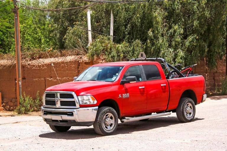 Red pickup truck Dodge Ram 2500 drives at the countryside., Can A Ran 2500 Pull A Fifth Wheel?