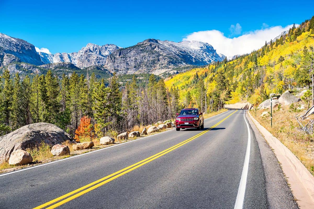 SUV drives in rocky mountain national park Colorado USA