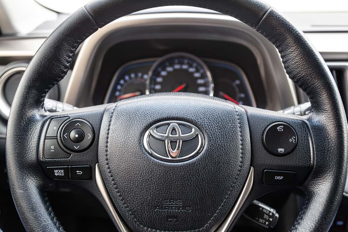 The interior of the car Toyota Rav4 with a view of the steering wheel, dashboard