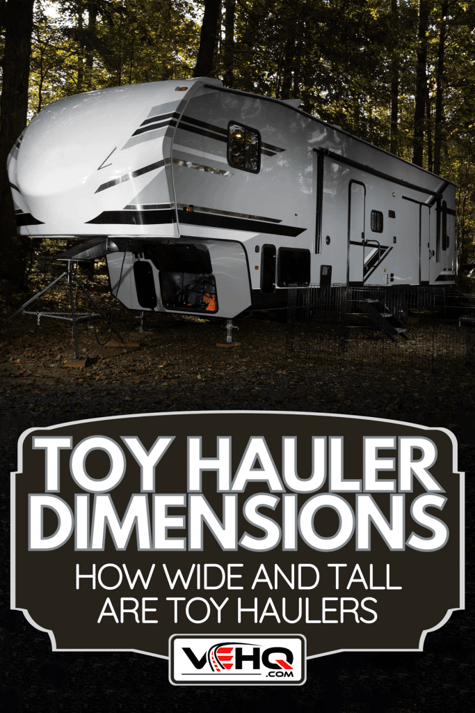 Camping trailer at a forested area just before sundown, Toy Hauler Dimensions: How Wide And Tall Are Toy Haulers