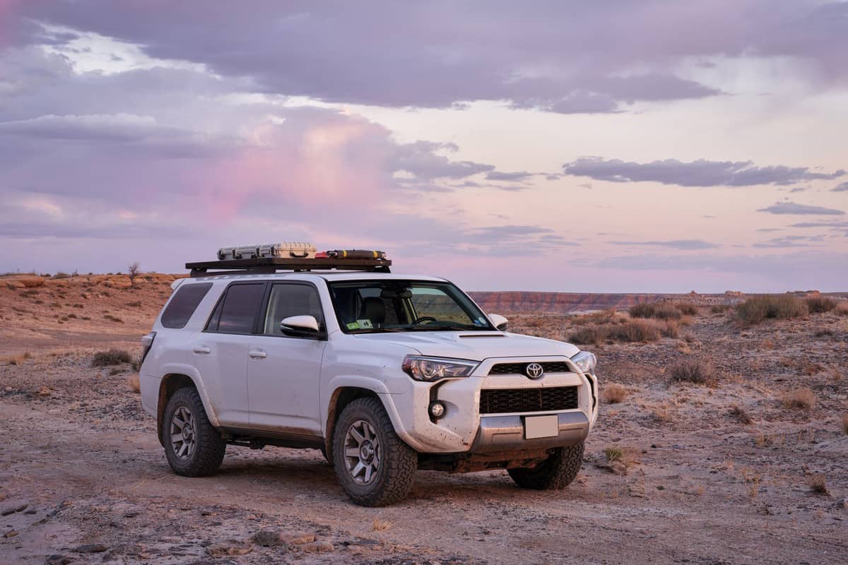Toyota 4Runner SUV (2016 Trail model) at dusk in rock desert landscape