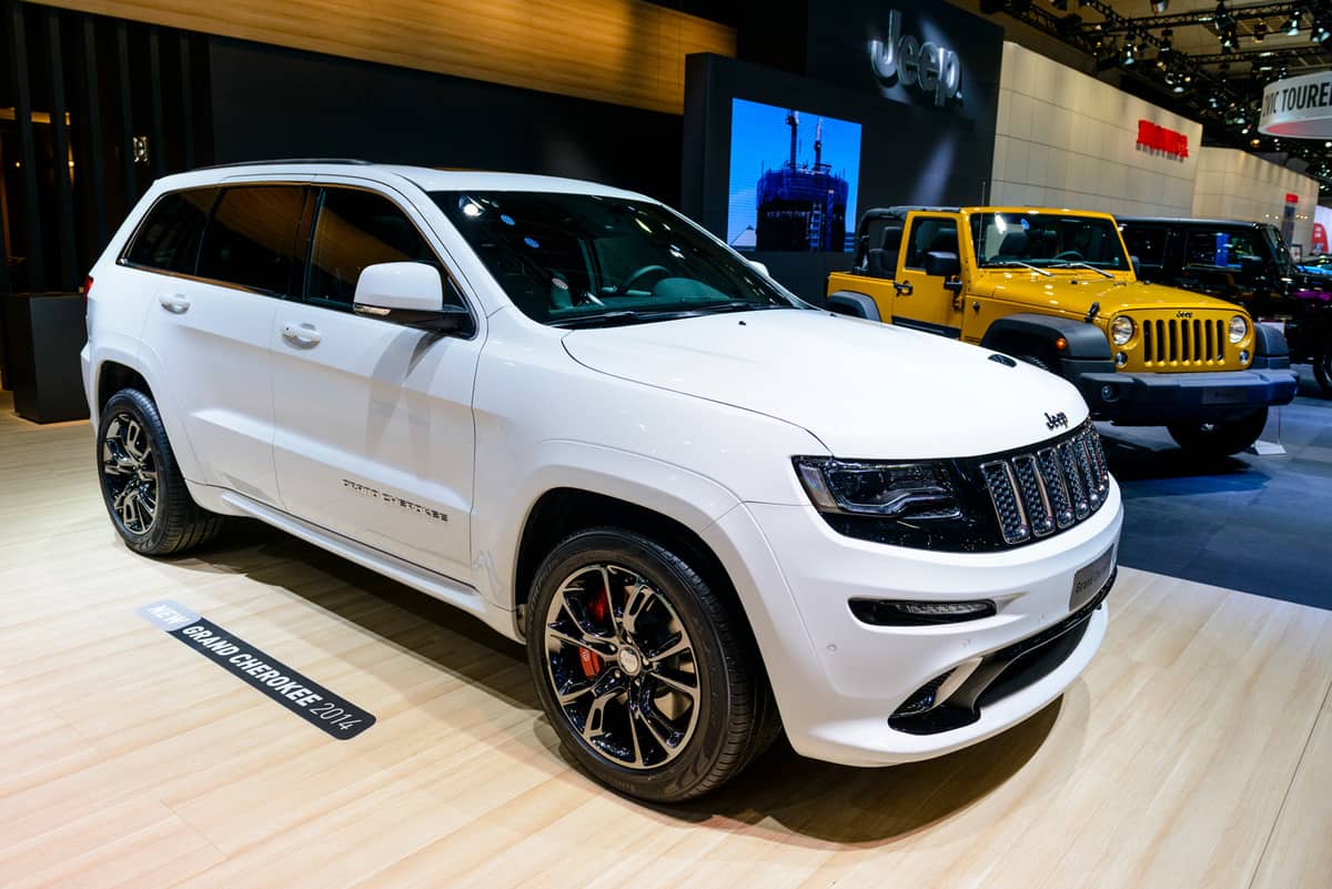 White 2014 Jeep Grand Cherokee SUV on display at the 2014 Brussels motor show.