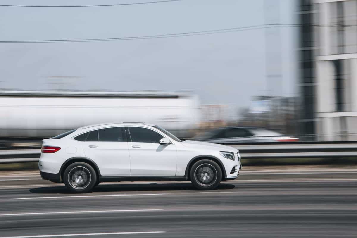 White Mercedes-Benz GLC Coupe car moving on the street