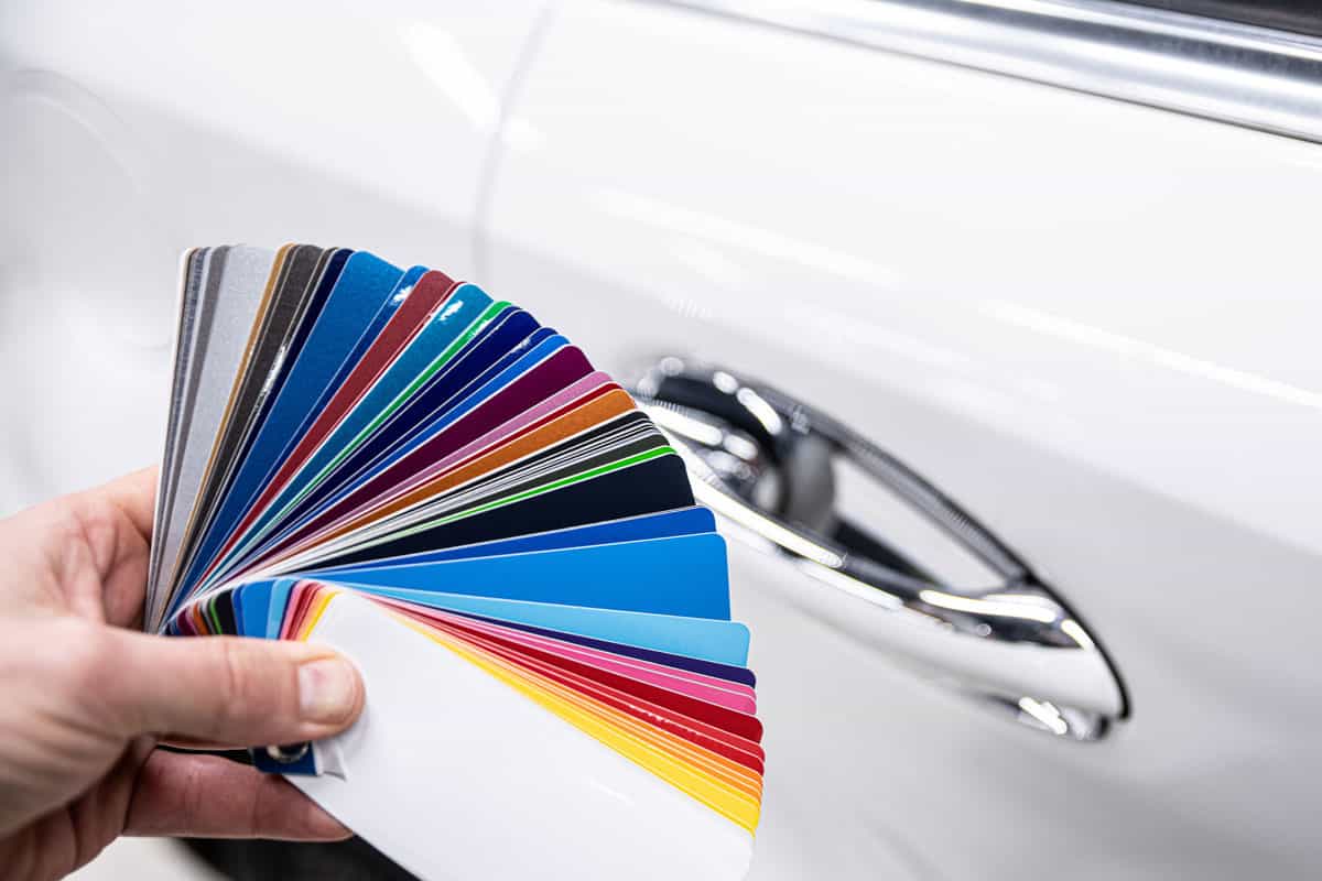 choosing color of his car with color sampler.