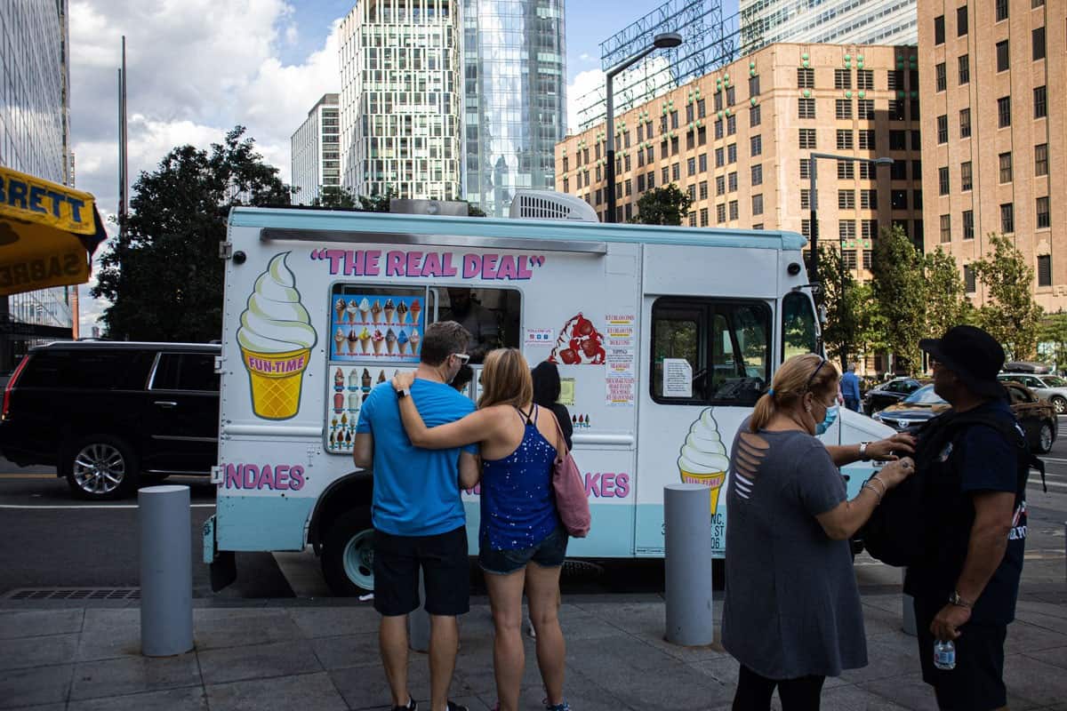 people wants to buy ice cream on the street of downtown