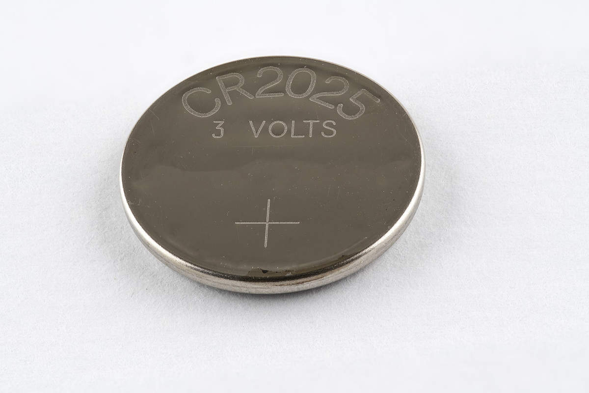 A CR2025 button cell lithium battery isolated